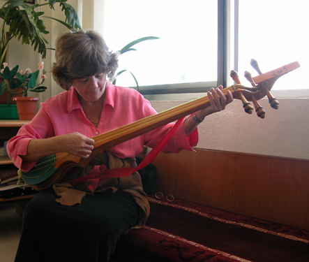 Susan learning to play the Tibetan-Nepali tonga